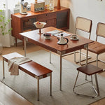 table manger rectangulaire bois foncé chaises osier tressé bancs assortis meuble bas vitré déco