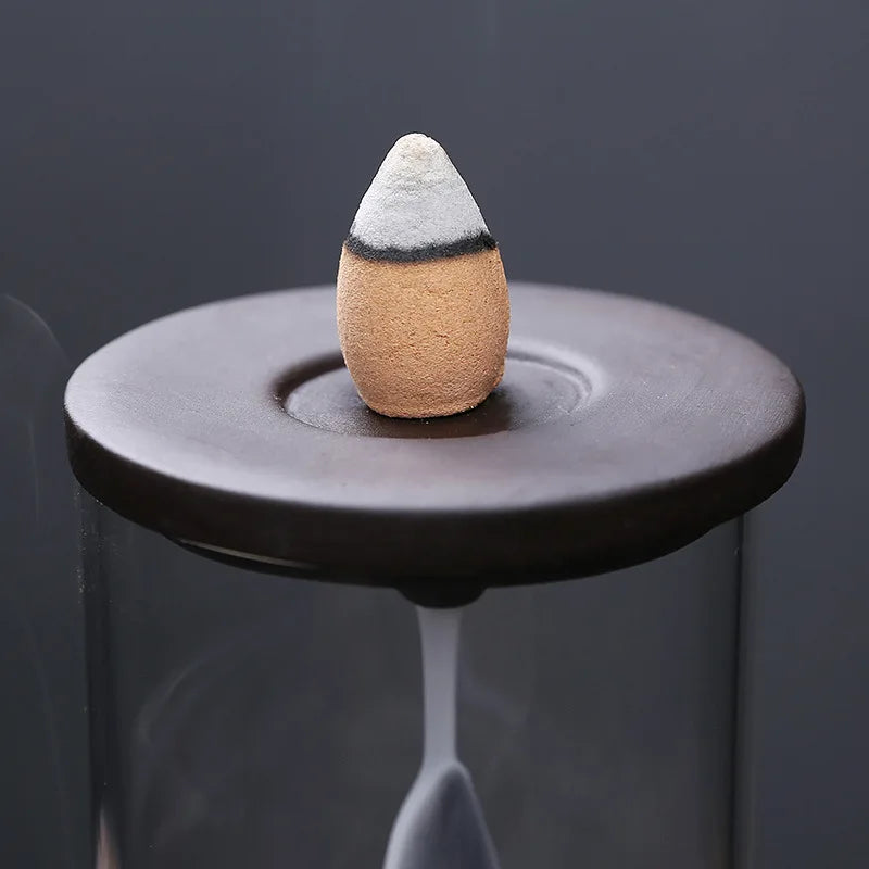 diffuseur encens bouddha verre transparent sculpture tête noir beige minimaliste