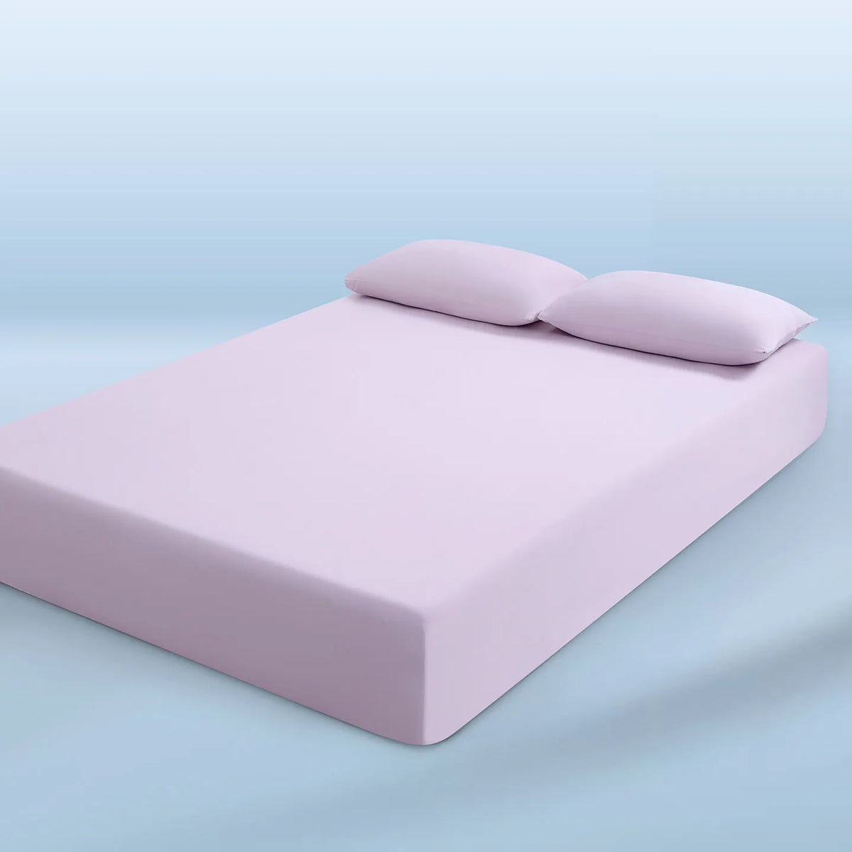 parure lit bleu clair drap housse élastique deux oreillers coton doux chambre moderne