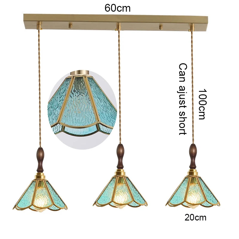suspension lumineuse verre teinté art deco or marron bleu clair motifs géométriques opacité chaînes