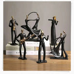 statue musicien moderne abstraite saxophone guitare noire décoration intérieure couple instrumental résine opaque base