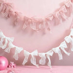 décoration festive guirlande nœuds rose tissu texturé semi transparent mariage anniversaire enfant baby shower