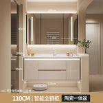 meuble salle bain moderne évier tiroirs beige clair miroir lumineux tapis motifs cosmétiques dorés