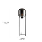 lampe sol moderne transparente ampoule filament noir gris fumé led verre minimaliste