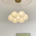 Suspension lumineuse moderne cristal blanc légèrement translucide chaînes métalliques