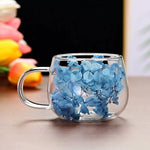 tasse verre double paroi fleurs séchées transparente poignée cuillère dorée moderne