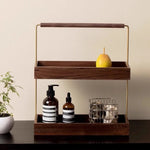 caisse cosmétiques bois foncé rangement maquillage minimaliste poignée dorée lotion bouteille panier naturel