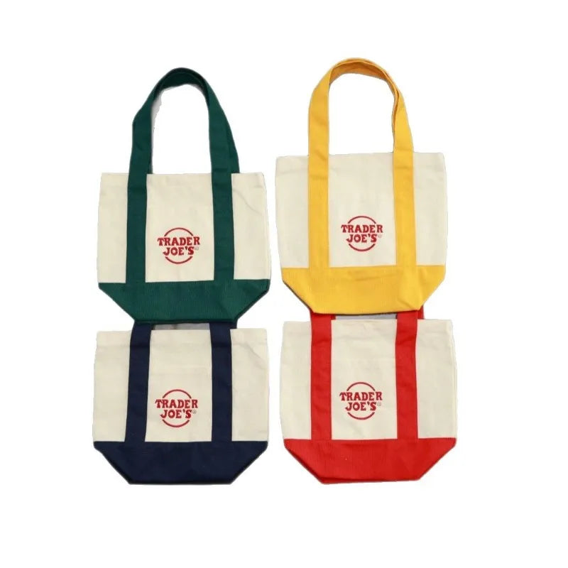 sac main toile verte rouge blanc jaune trader joes logo poignées simple pratique