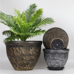 pots fleurs noirs classiques gravures feuilles fleurs plateau drainage visible