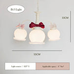 chandelier suspension vert pâle rubans roses abat jour translucides chambre enfant romantique
