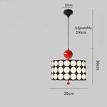 lampe suspendue moderne noire blanche rouge points blancs opacité chambre salonhôtel
