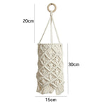 lampe suspendue boho macramé blanc cassé motifs géométriques boule bois franges decoration maison salon