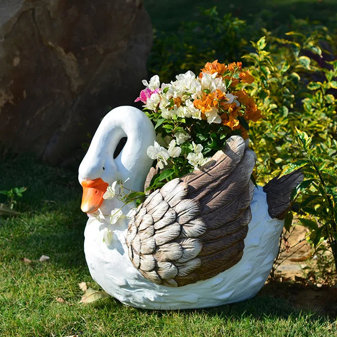 statue cygne pot fleur jardin blanc plumes décoratif fleurs diverses couleurs rock texture rustic
