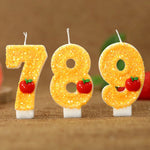 bougies numeriques jaune paillette pomme rouge anniversaire decoratif thème feuille verte paillettes dorées tringle