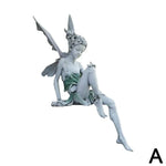 statuette fée assise bronze foncé gris clair vert pâle ailes ajourées fantaisiste jardinextérieur résistanteintempéries