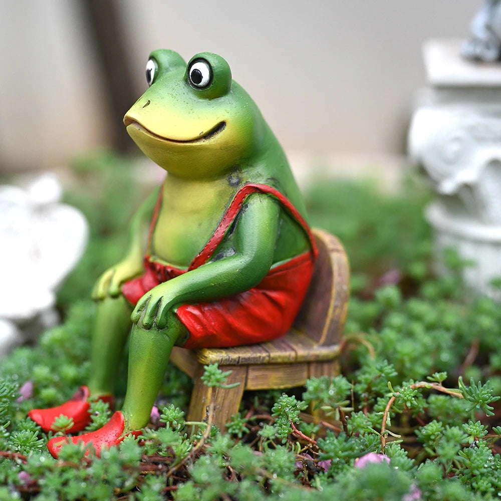 statue grenouille verte banc bois grenouille chaussures rouges deco jardin pastel fantaisiste