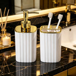 porte brosses dents distribiteur savon moderne noir or blanc or texturé vertical salle bain