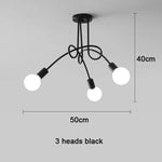 suspension lumineuse moderne minimaliste noir or blanc branches incurvées métal fixation ampoles led