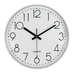 horloge murale cadre doré aiguilles noires numéros blancs moderne chambre coucher