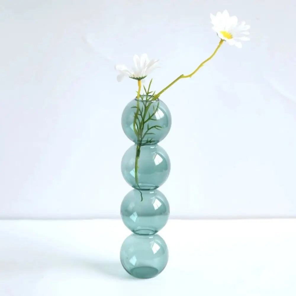 vase moderne transparent sphères empilées jaune clair rose bleu vert brun