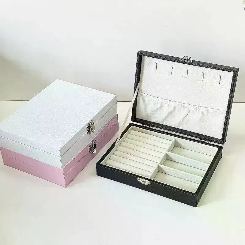 boîte bijoux simili cuir noir blanc rose compartiments cadenas classique organisation sécurité
