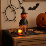 figurine halloween citrouille lumineuse orange visage chapeau robe noire bas rayés automne