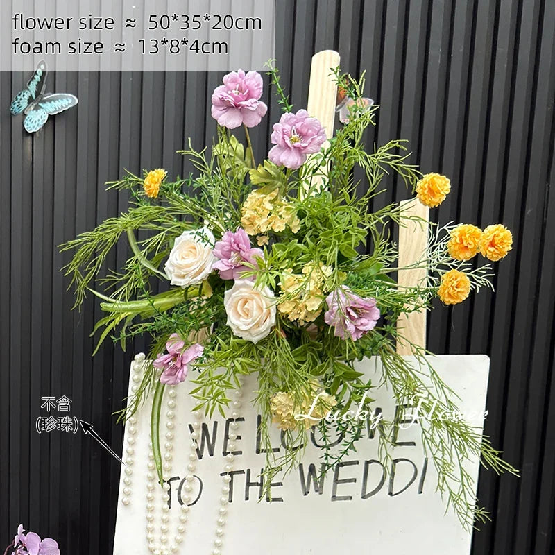 décoration murale naturelle composition florale variée couleurs vives rustique bienvenue mariage
