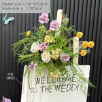 décoration murale naturelle composition florale variée couleurs vives rustique bienvenue mariage