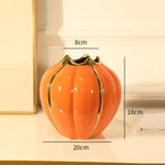 vase moderne élégant orange vert rayures bordure dorée fleurs artificielles décoration intérieure table salon
