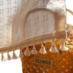rideau blanc cassé bohème franges pompons tissage texturé motif carré translucide décoration intérieure