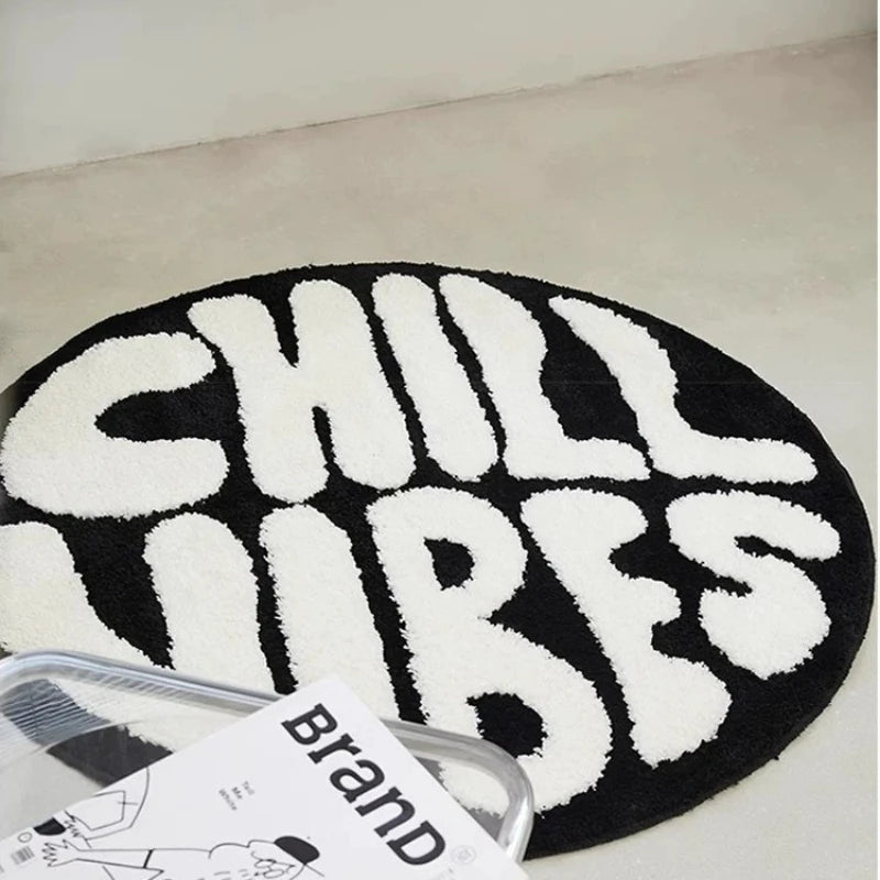 tapis rond noir blanc CHILL VIBES lettres texturées doux moderne salon chambre