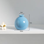 vases décoratifs modernes couleurs blanc rose vert bleu violet rond lissesintérieur maison