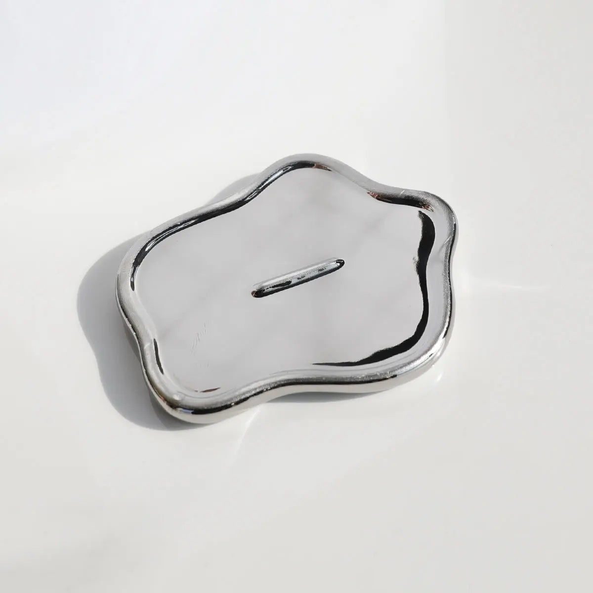 support bijoux argenté moderne plateau lisse brillant rangement clés ornement