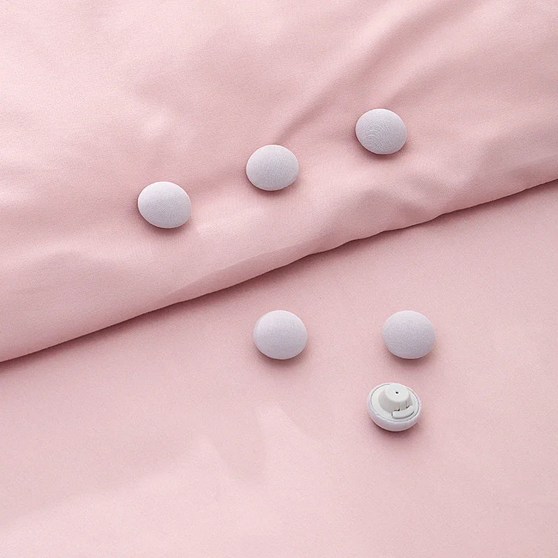 porte plaid peluche rose clair gris yeux fermés doux anti dérapant fixateur couette