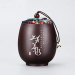 pot thé marron imprimé floral couvercle texte blanc classique traditionnel cordon boule bois épices