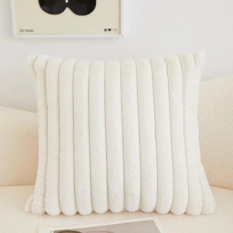 coussins rectangulaires peluche douce rose clair vert pastel lit tissé rayures horizontales moderne respectueux