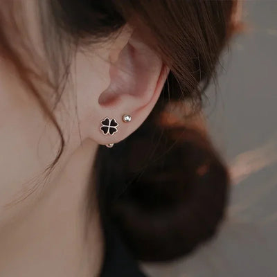 Boucles d'oreilles argent 925 trèfle porte-bonheur noir plante vue de face
