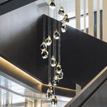 suspension lumineuse moderne transparente dorée facettes géométriques élégante leds