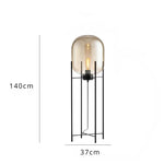 lampe sol moderne transparente ampoule filament noir gris fumé led verre minimaliste