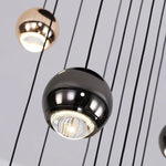 suspension lumineuse contemporaine noir doré sphères métalliques brillantes éclairage intérieur maison