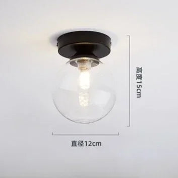 lampe moderne verre transparent noir doré élégante sphérique éclairage contemporain