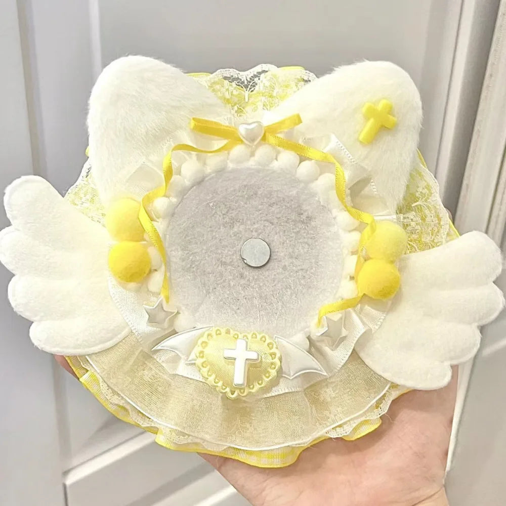 couronne baptême ailes rubans pompons croix dentelle blanche rose violet bleu jaune