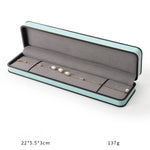 boîtes bijoux cuir beige turquoise intérieur noir moderne emballage présentation anneaux haute qualité
