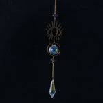 bijou pendentif cristal or bleu violet vert formes géométriques motifs oculaires translucides boho chic