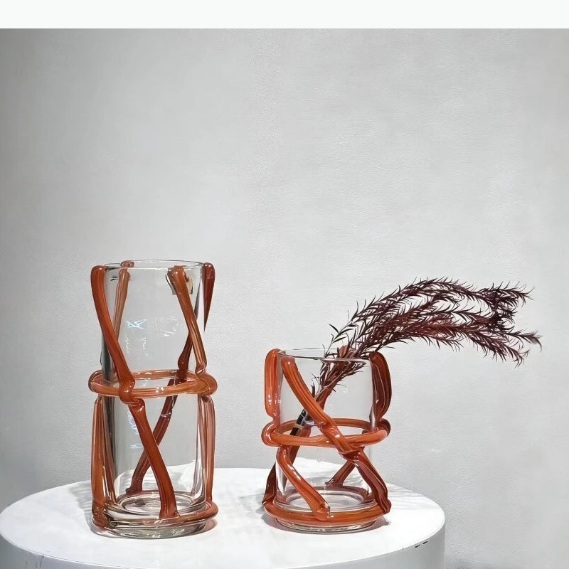 vase moderne transparent tiges entrelacées orange sans fleur