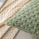 coussins carrés vert clair beige rose pâle texture tissée pompons moderne fermeture glissière