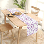 nappe runner moderne violet abstraits vagues assiettes blancs fourchettes couteaux bougie fleurs fruits
