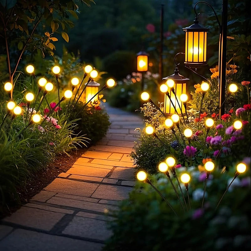 éclairage paysager solaire led moderne boules lumineuses colorées branches métalliques fixation tige terreextérieur nocturne