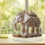 statue élégante éléphant blanc doré artisanal support transparent traditionnel ornement diamants