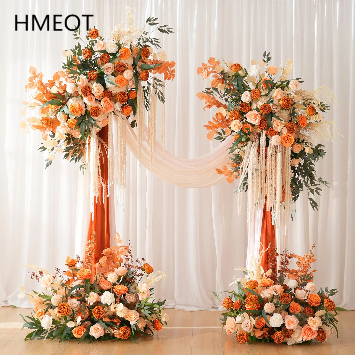 arche décorative boho chic fleurs artificielles orange feuilles vertes franges blanches extérieur mariage anniversaireévénement